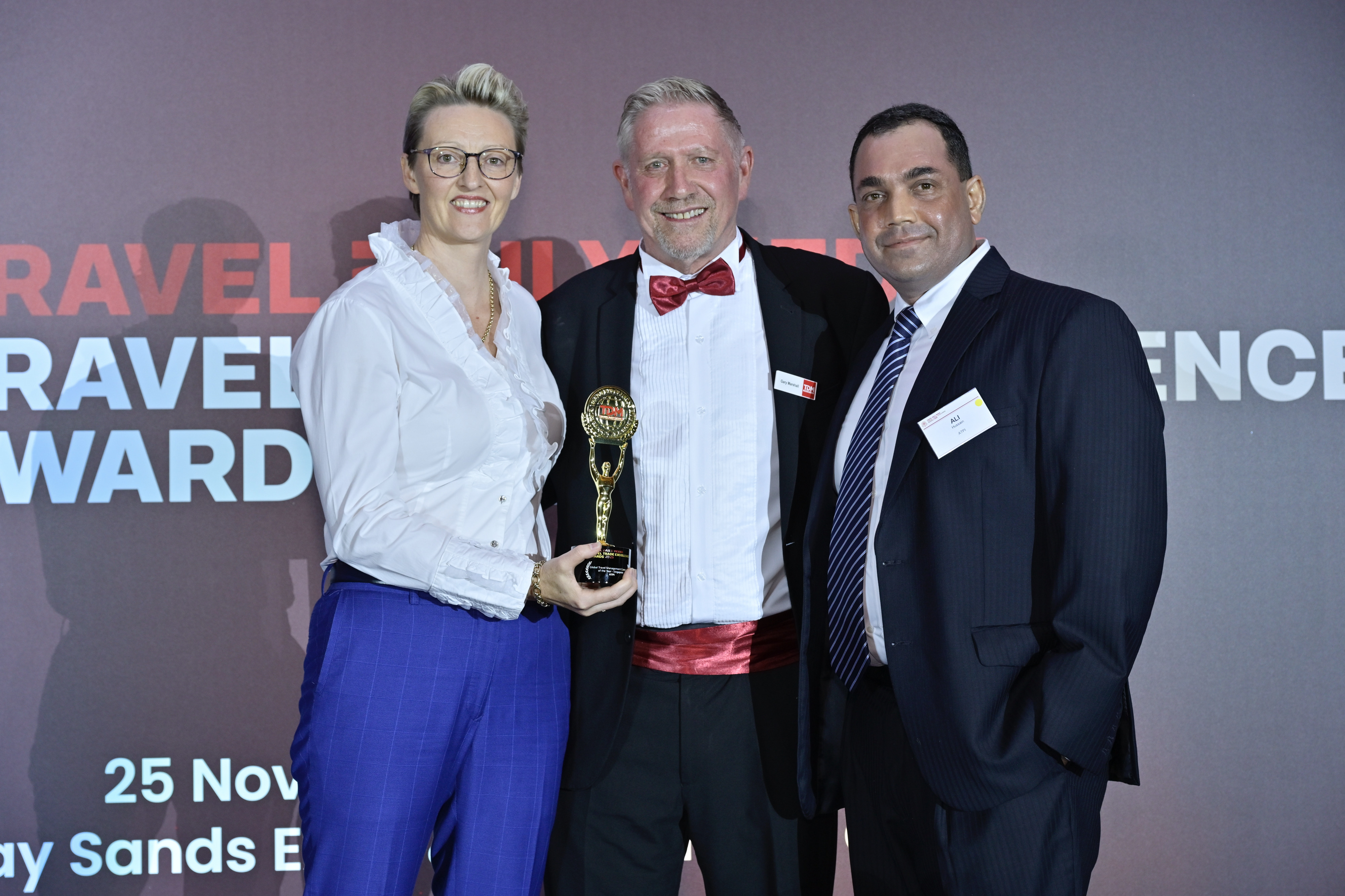 Ali Hussain, Regional Managing Director, ATPI - Asia Pacific (far right) and Kelly Jones, Managing Director, ATPI - Southeast Asia & China (far left), receiving the award for Global Travel Management Company of the Year at the TDM Travel Trade Excellence Awards in Singapore